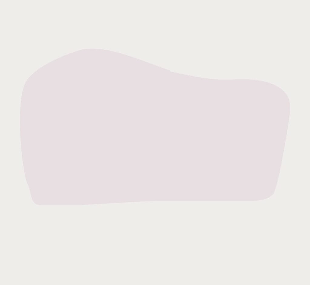 A soft, organic, light purple blob shape centered against a plain, off-white background, often used in About Us sections for a minimalist design.