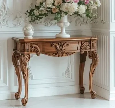 A lush floral arrangement in a white vase sits on an ornate wooden console table against a classic white paneled wall, reflecting Cladsi style.